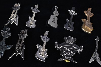 Lot 7 - A collection of ten chrome Hard Rock Café Cayman Islands pin badges