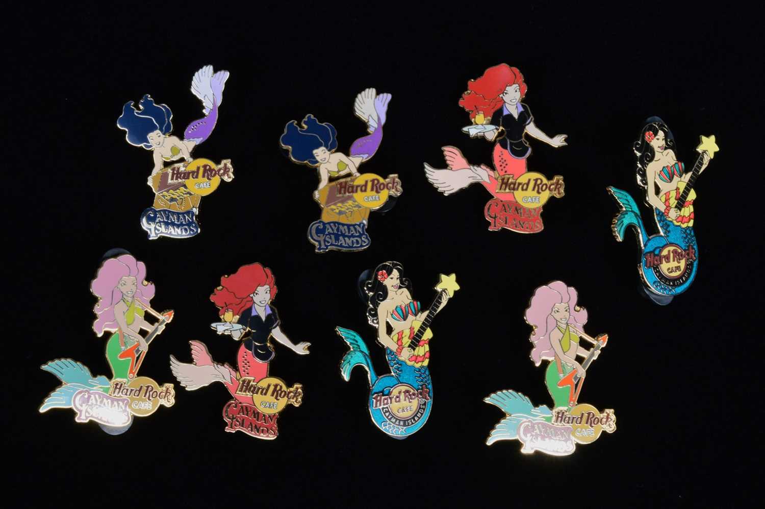 Lot 12 - A collection of eight Mermaid Hard Rock Café Cayman Islands pin badges