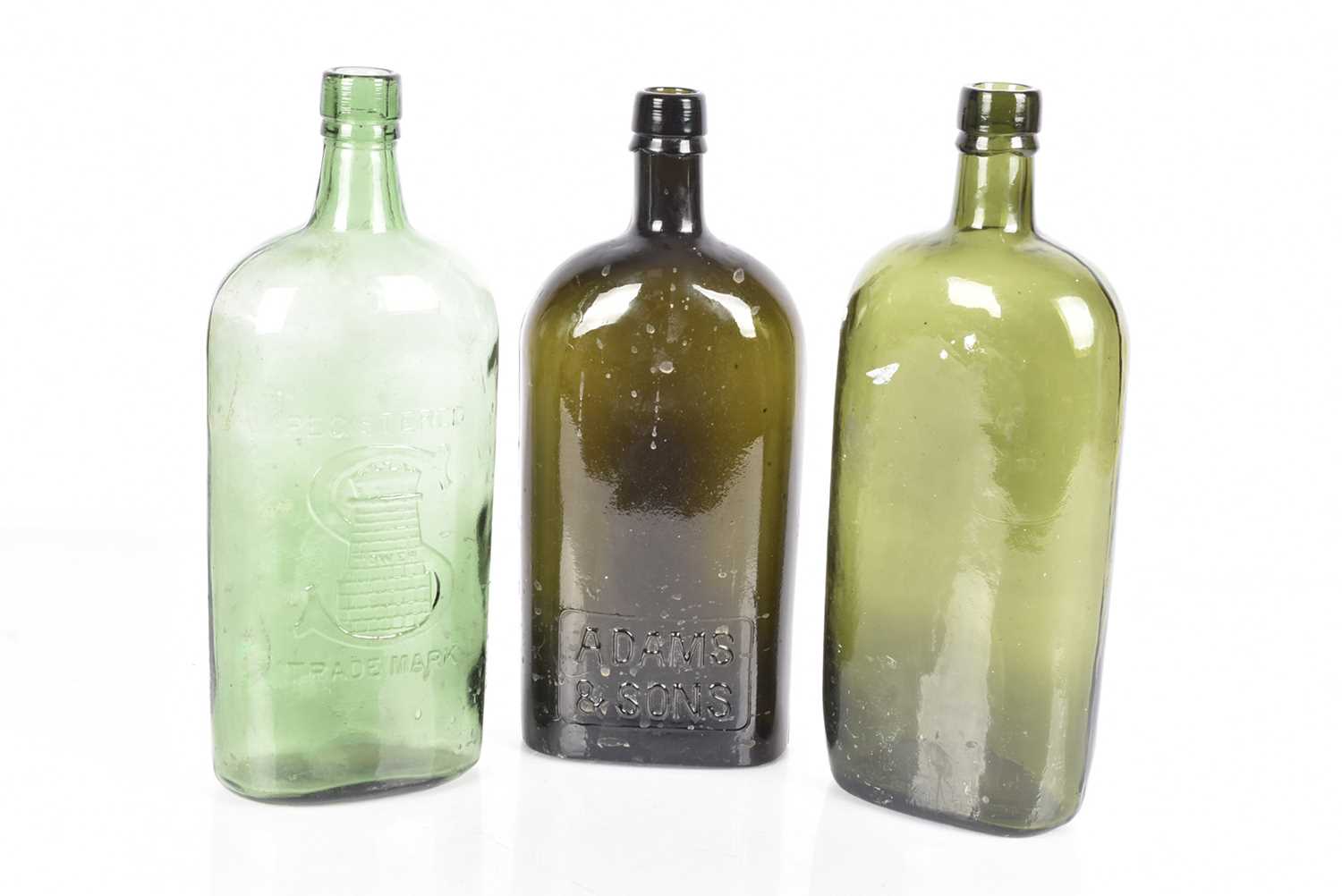 Lot 65 - Three vintage green glass bottles