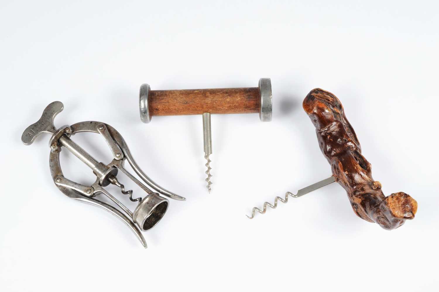 Lot 228 - A set of three corkscrews