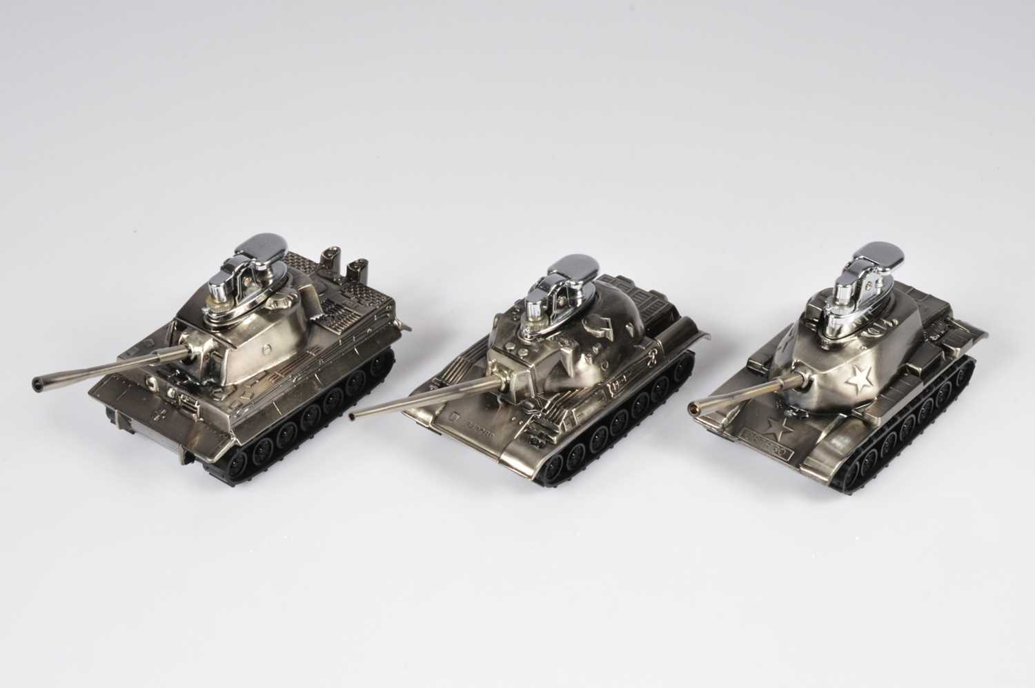 Lot 235 - Three novelty tank table lighters