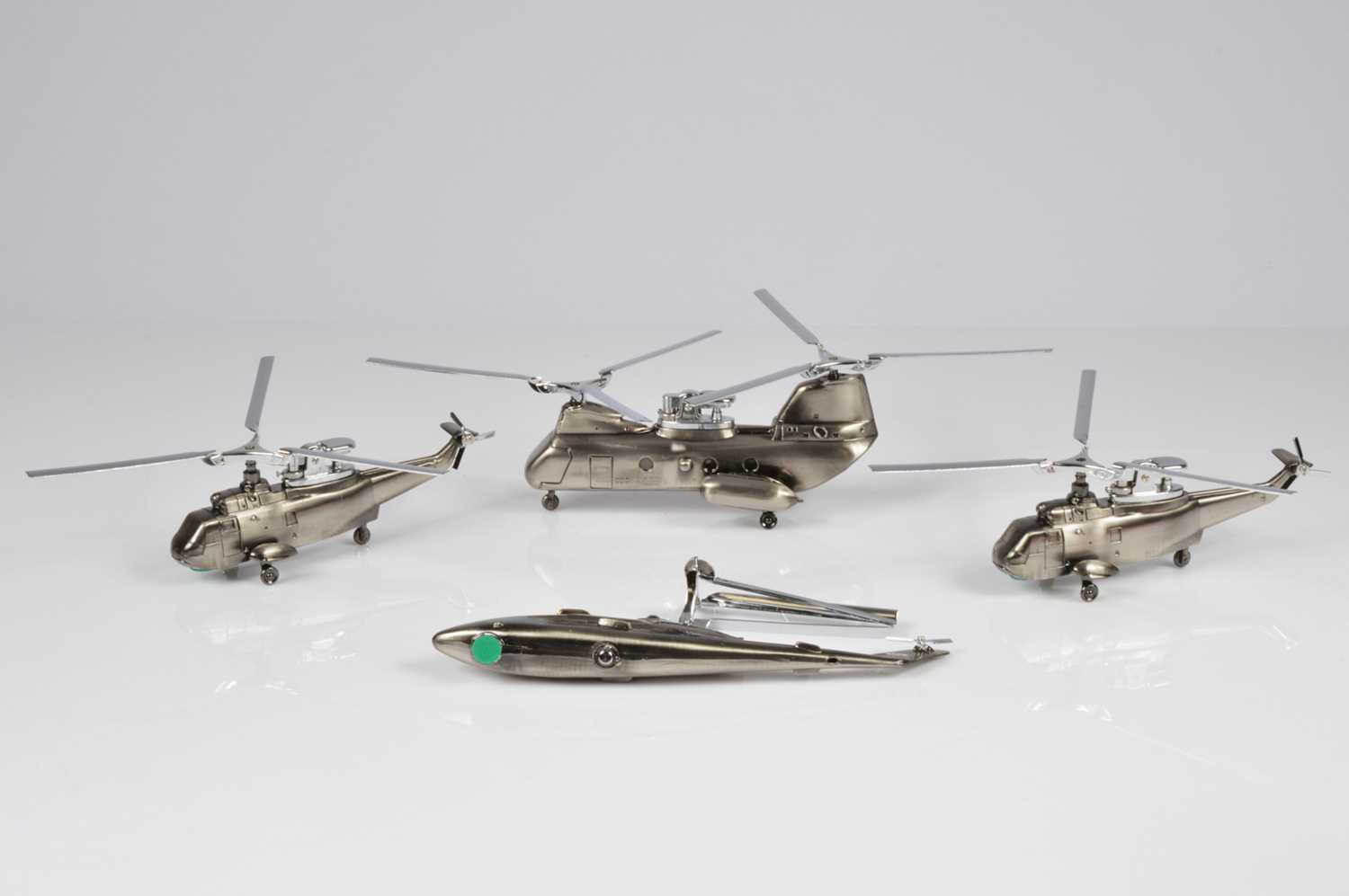 Lot 236 - Four novelty Helicopter table lighters