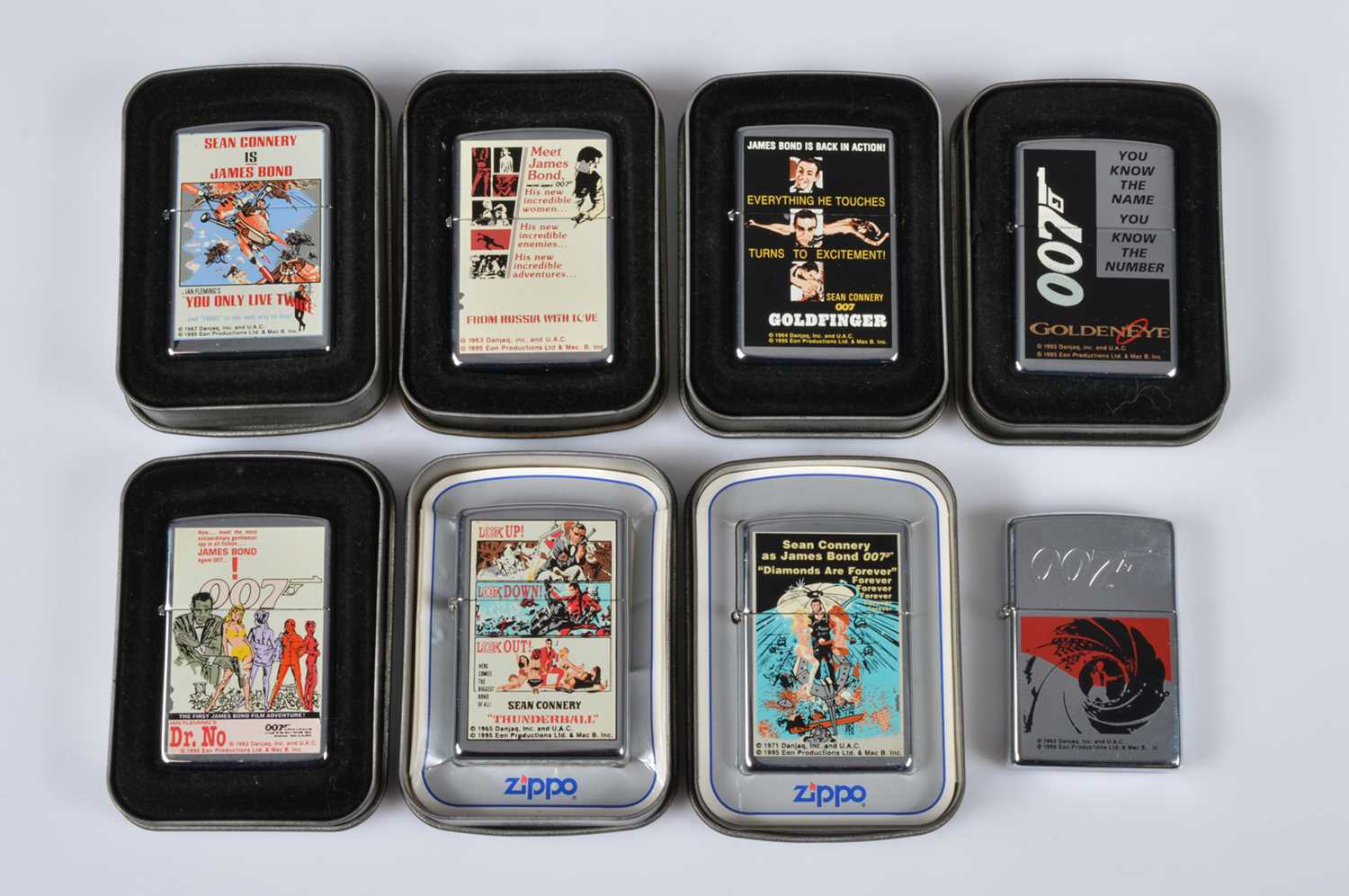 Lot 264 - A set of eight 1996 James Bond Film Zippo Lighters
