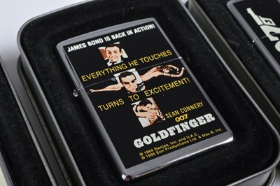 Lot 264 - A set of eight 1996 James Bond Film Zippo Lighters