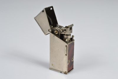 Lot 282 - A Cartier Ovale bi-metal pocket lighter