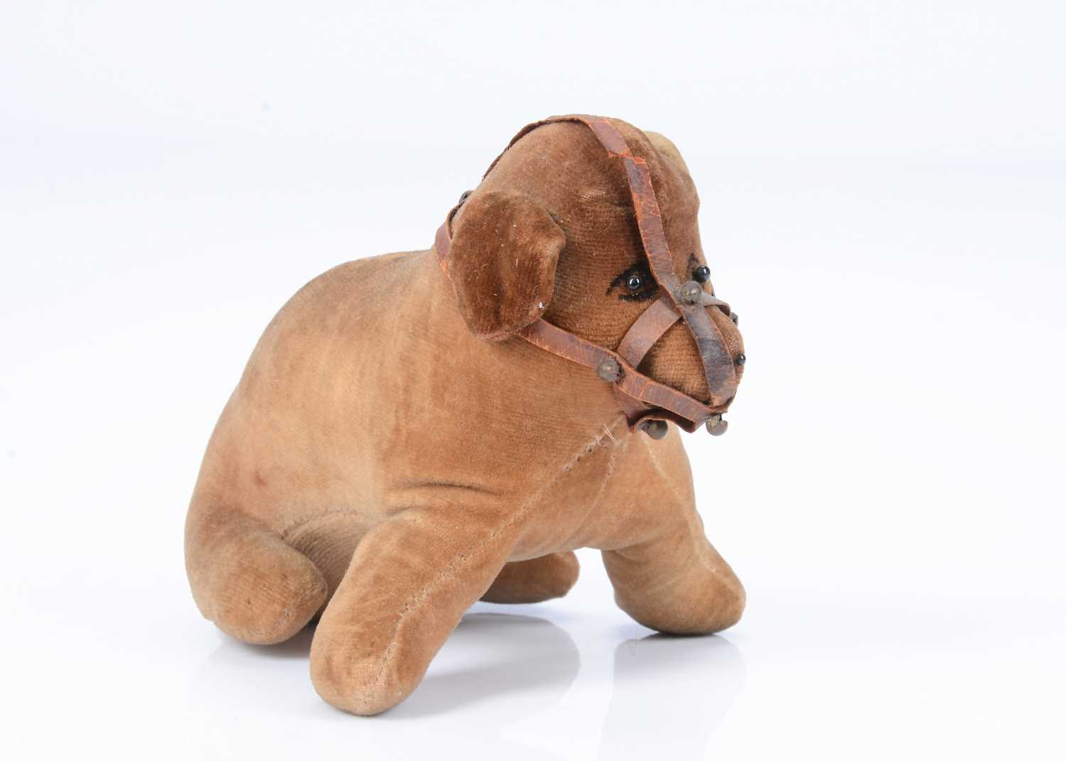 Lot 56 - A 1910/20s British velvet muzzled dog