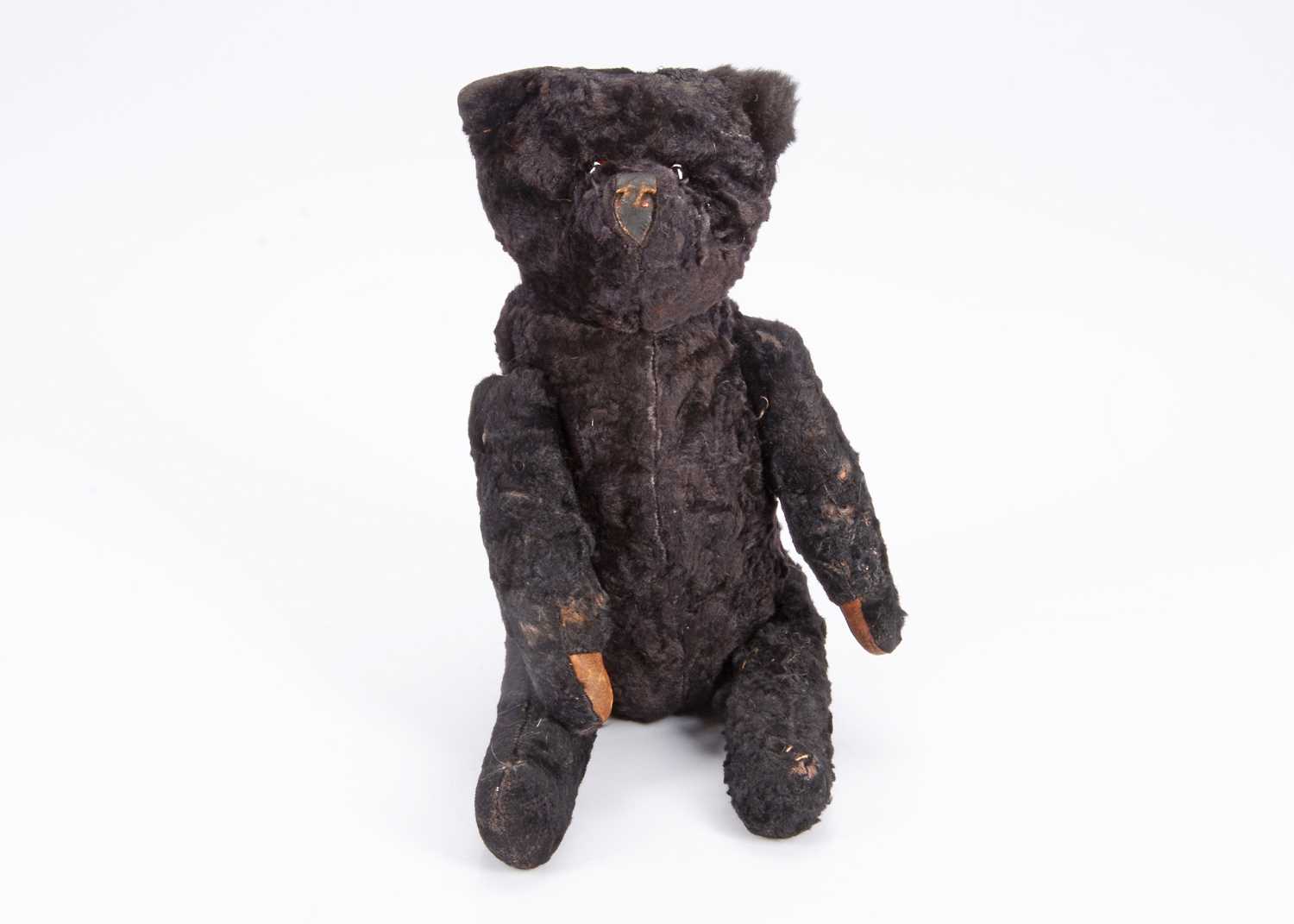 Lot 69 - An interest black teddy bear, circa 1915 -20
