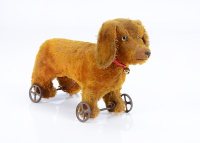 Lot 110 - An early German Dachshund on wheels, circa 1910