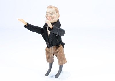 Lot 183 - An early 20th century German composition headed Joseph Chamberlain clockwork tumbling toy