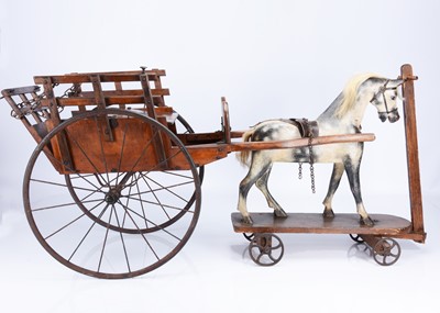 Lot 185 - A large G & J Line wooden ride on horse and hay cart