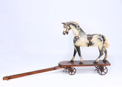 Lot 185 - A large G & J Line wooden ride on horse and hay cart