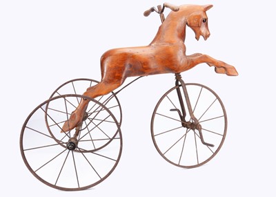 Lot 186 - An early 20th century English carved wooden horse velocipede