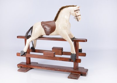 Lot 187 - An early 20th century English small carved wooden rocking horse