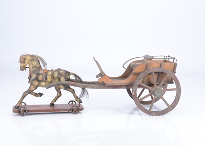 Lot 188 - A fine 19th century English pull-along trotting horse and delivery cart
