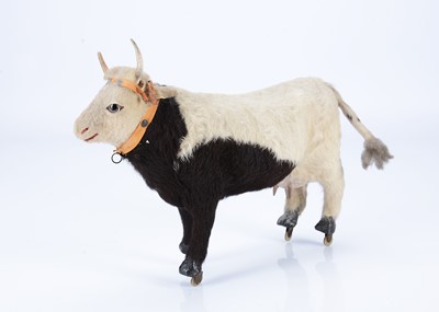 Lot 202 - A late 19th century toy skin covered cow