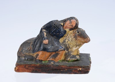 Lot 207 - A mid 19th century Thüringen papier-mâché boy and sheep squeak toy