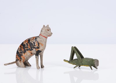 Lot 218 - Large scale Erzgebirge tortoise-shell cat and grasshopper