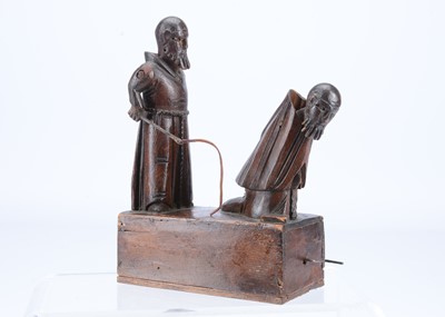 Lot 230 - An 19th century Grödnertal carved wooden hand cranked toy of flagellating monks