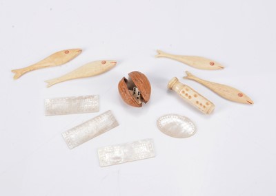 Lot 249 - An 19th century walnut shell holding three bone dice
