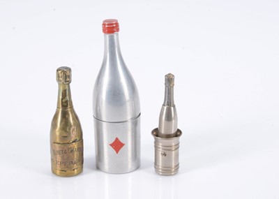 Lot 253 - Three metal champagne bottle dice holders
