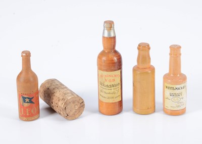 Lot 254 - Four turned wooden alcohol bottle dice holders