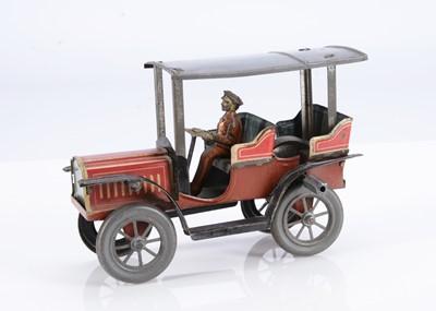 Lot 280 - An early 20th century small Carette flywheel driven lithographed tinplate tourer