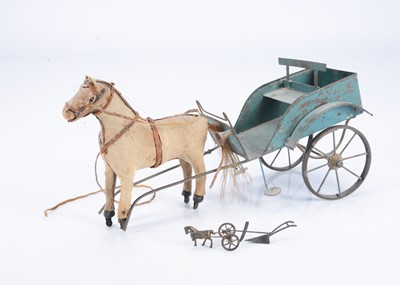 Lot 284 - A French painted tinplate cart with skin covered horse