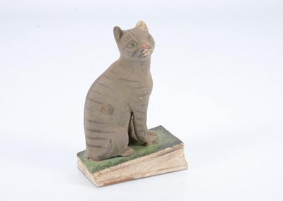 Lot 286 - A mid 19th century composition cat squeak toy