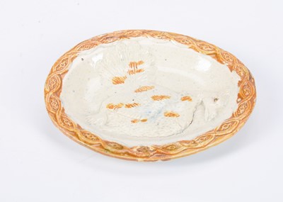 Lot 484 - A rare Prattware type pearlware dolls or large dolls’ house serving plate with dead fowl, circa 1790