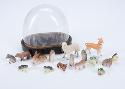Lot 494 - A small glass dome containing a selection of German bisque animals