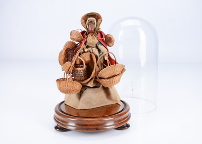 Lot 504 - A rare mid 19th century wax headed basket seller