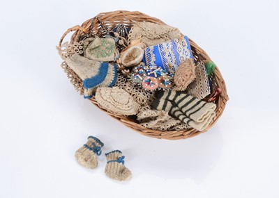 Lot 516 - An 19th century pedlar’s basket of textiles
