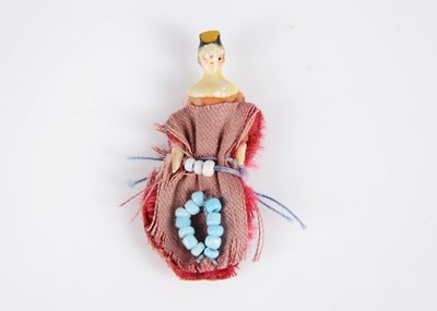 Lot 522 - An 19th century Grodnertal carved wooden miniature dolls’ house doll with tuck comb