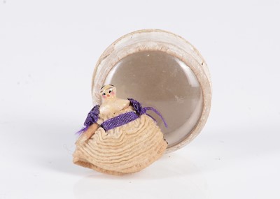Lot 523 - An 19th century Grodnertal carved wooden miniature dolls’ house doll