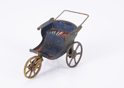 Lot 546 - An 19th century painted tinplate dolls’ house three-wheeled push chair