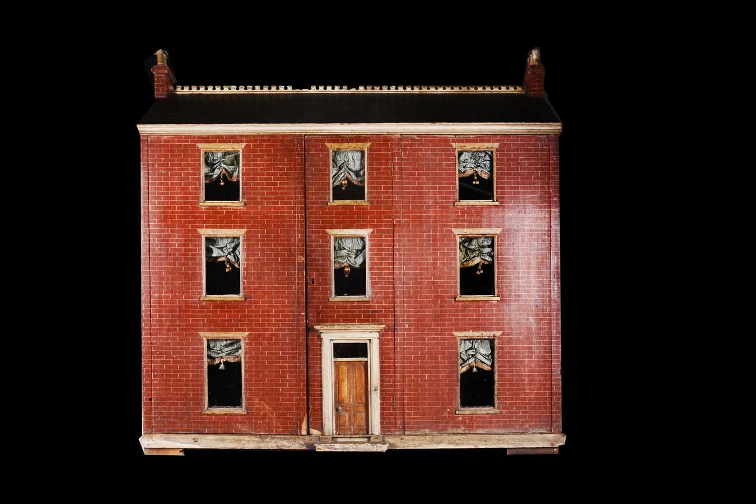 Lot 562 - A large 19th century English painted wooden red brick dolls’ house