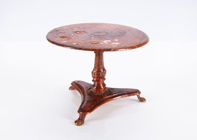 Lot 569 - An 19th century Evans and Cartwright painted tinplate dolls’ house circular table