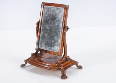 Lot 570 - An 19th century Evans and Cartwright painted tinplate dolls’ house toilet mirror