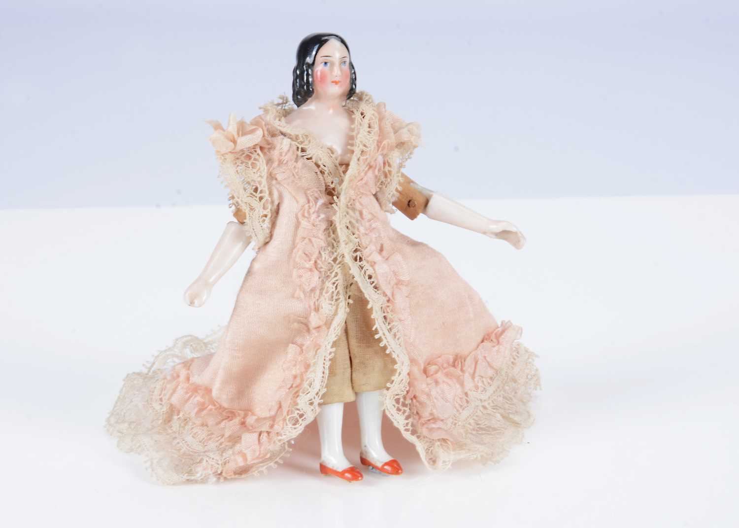 Lot 586 - A rare Kister china shoulder-head dolls’ house doll.