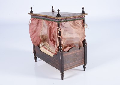 Lot 679 - A large 19th century Waltershausen dolls’ house four-poster bed