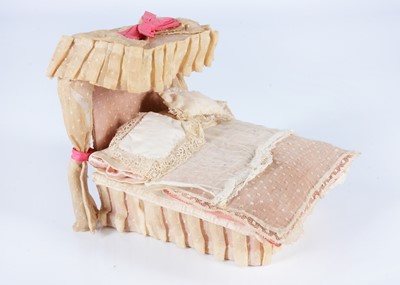 Lot 682 - An 19th century English card and cloth dolls’ house half-tester bed