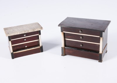 Lot 684 - Two 19th century Waltershausen dolls’ house chest of drawers