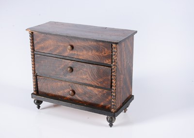 Lot 685 - An 19th century German dolls’ house chest of drawers