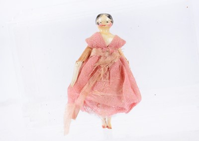 Lot 696 - An 19th century Grodnertal carved wooden small dolls’ house doll