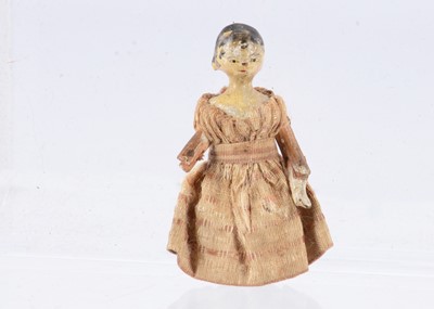 Lot 697 - An 19th century Grodnertal carved wooden small dolls’ house doll