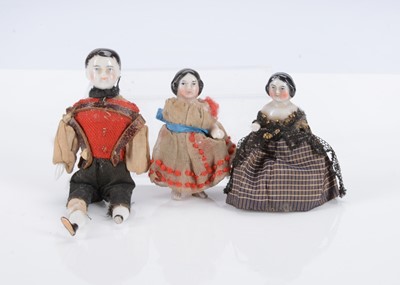 Lot 703 - An 19th century dolls’ house china shoulder boy doll and two Frozen Charlottes