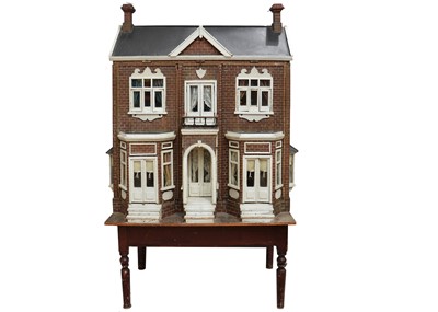 Lot 760 - A large Edwardian English wooden dolls’ house on stand