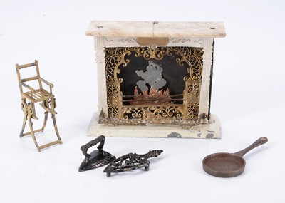Lot 786 - An 19th century German soft metal and tinplate dolls’ house fireplace