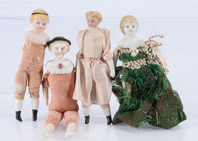 Lot 801 - Four German bisque shoulder-head dolls' house dolls