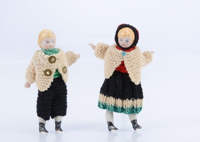 Lot 802 - A pair of Simon & Halbig bisque children shoulder-head dolls’ house dolls in original knitted clothes